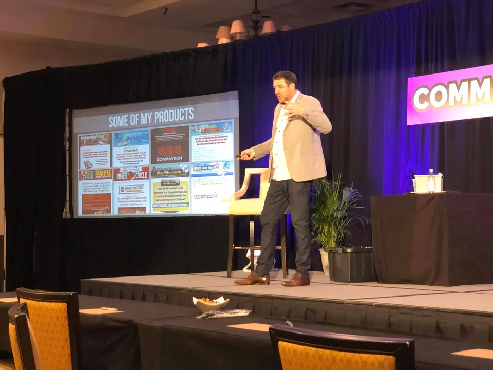 John Thornhill speaking on stage at a marketing event